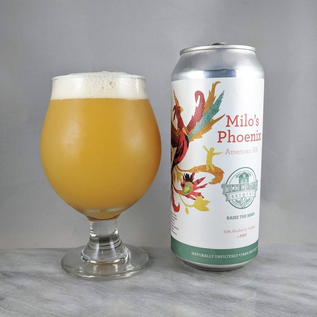 Beer: Milo’s Phoenix
Style: IPA
ABV: 6.8%
IBU: 79
Hops: ?
———————————–
Brewery: Tilted Barn Brewery – Exeter, RI
Brewery IG: @tiltedbarnbrewery
———————————–
Rating: 4.25/5
Notes: Ohhh nice. Very smooth with all that tropical stone fruit flavor. Not hop burn and very crushable.
Can art : Great illustration. Nice. 
Drinkage: 37 days after date on can.  A bit late for sure but still held up nicely.
———————————–
